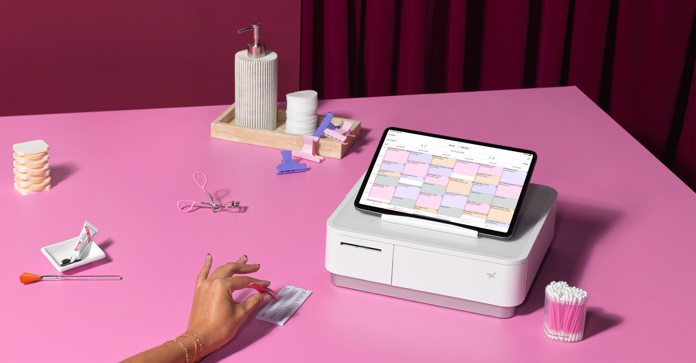 Timely after: the app on a beauty counter with the flowers, and Ryan Baker and Jo Blundell at the flower wall.